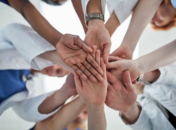 Hands joined together in a circle.